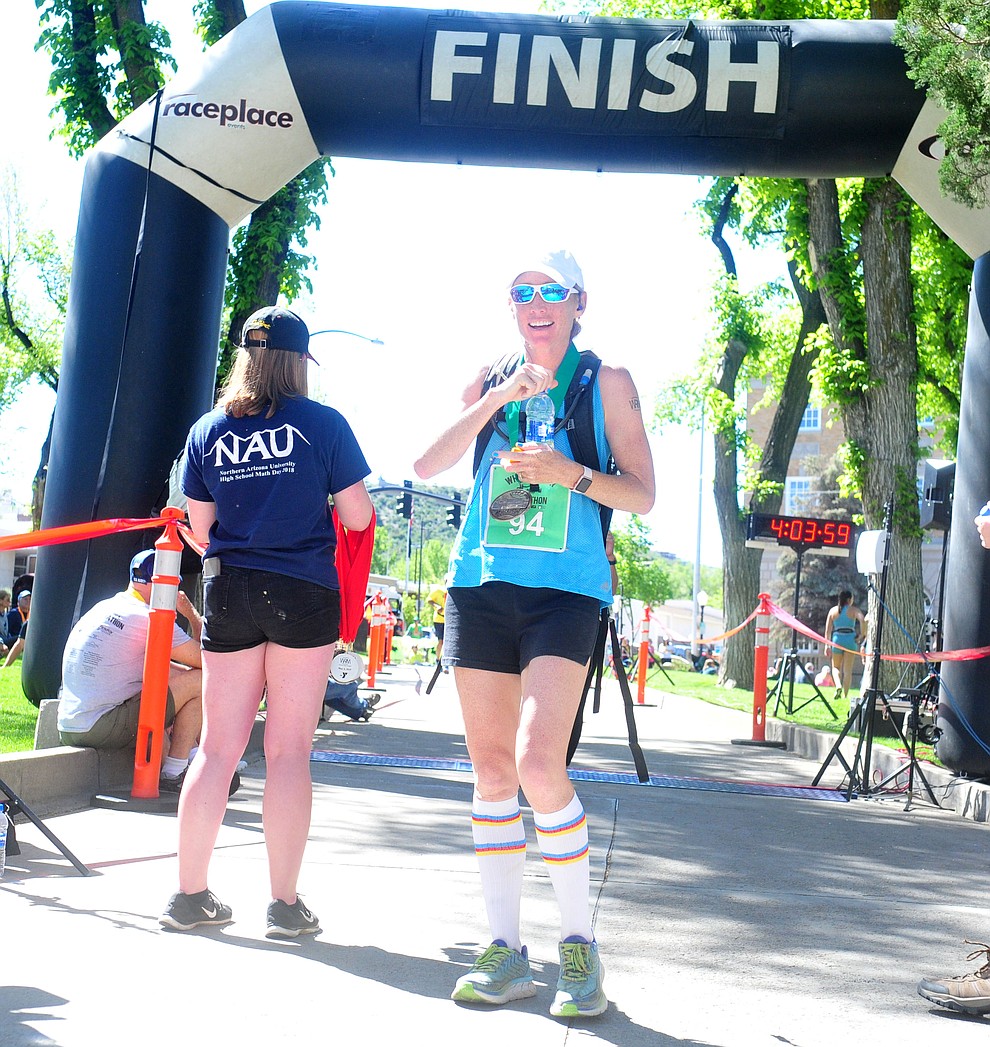Hilary Dartt finishes her first marthon during the 41st annual Whiskey Row Marathon Saturday, May 4. (Les Stukenberg/Courier)