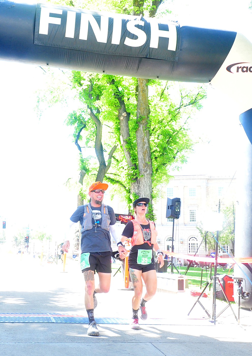 Jeff Hemperly and Holly Hovious finish the marthon together during the 41st annual Whiskey Row Marathon Saturday, May 4. (Les Stukenberg/Courier)