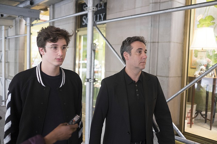 Michael Cohen, right, President Donald Trump's former personal attorney, walks down the street with his son Jake after leaving his apartment, Saturday, May 4, 2019, in New York. Cohen is scheduled to report to a federal prison on Monday, May 6, to begin serving a three-year sentence for campaign-finance violations, tax evasion, bank fraud, and lying to Congress. (Jonathan Carroll/AP)