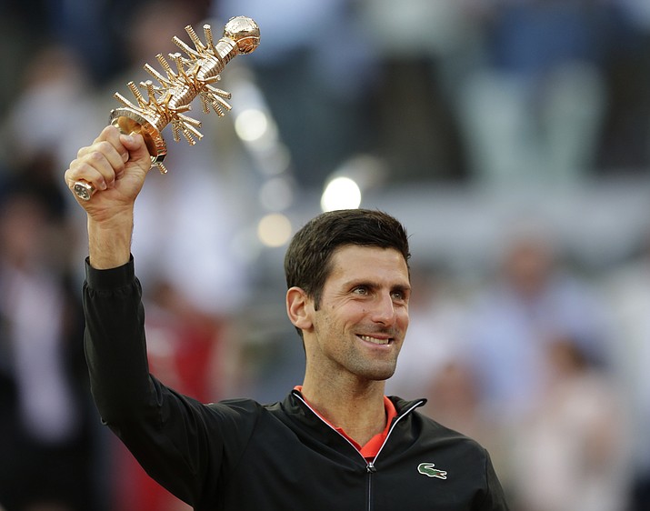Serbia’s Novak Djokovic holds the trophy after winning the final of the Madrid Open tennis tournament in two sets, 6-3, 6-4, against Greece’s Stefanos Tsitsipas in Madrid, Spain, Sunday, May 12, 2019. (Bernat Armangue/AP)