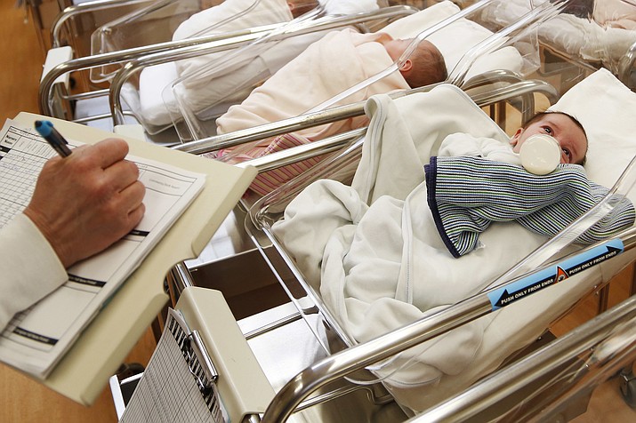 This Feb. 16, 2017 photo shows newborn babies in the nursery of a postpartum recovery center in upstate New York. According to a government report released Wednesday, May 15, 2019, U.S. birth rates reached record lows for women in their teens and 20s, leading to the fewest babies in 32 years. (Seth Wenig/AP, File)