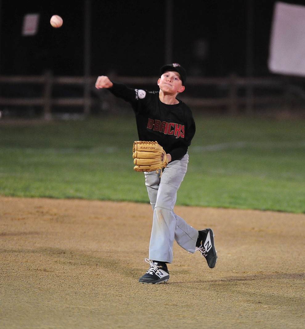 Tommy Richardson makes the throw from shortstop as Farmers Insurance faced off against the True Vaue in the Prescott Little League Majors City Championship Game Friday, May 17. (Les Stukenberg/Courier)