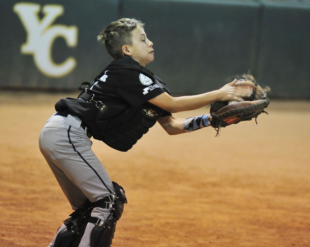 Dominic Cruz makes the catch as Farmers Insurance faced off against the True Vaue in the Prescott Little League Majors City Championship Game Friday, May 17. (Les Stukenberg/Courier)