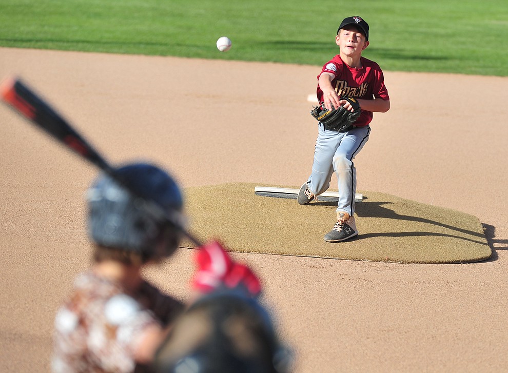 Nick Poynor delivers a pitch as the Grand Highland Cobras faced off against the Process Driven Baseball Diamondbacks in the Prescott Little League Minors City Championship Game Friday, May 17.  (Les Stukenberg/Courier)