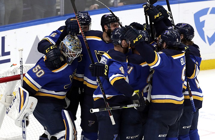 Members of the St. Louis Blues celebrate after defeating the San Jose Sharks 5-1 in Game 6 of the NHL hockey Stanley Cup Western Conference final series Tuesday, May 21, 2019, in St. Louis. (Tom Gannam/AP)