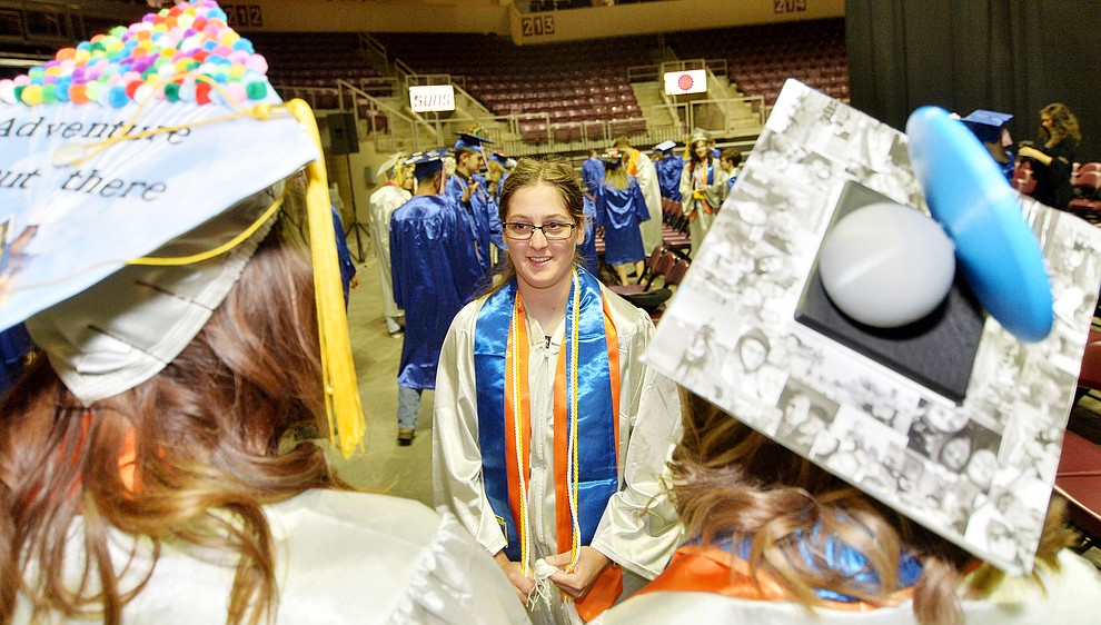 Abbie Golden talks with friends before Chino Valley HIgh School graduated 153 students in a commencement ceremony Wednesday, May 22 at the Findlay Toyota Center in Prescott Valley. (Les Stukenberg/Courier)