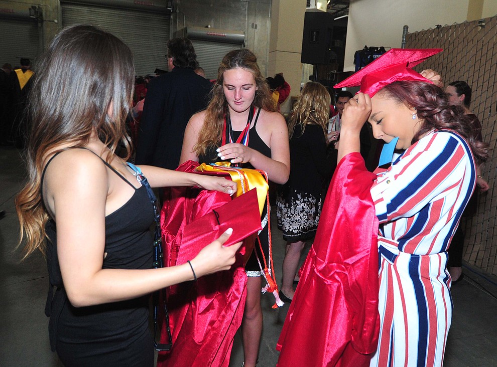 Bianca Lujan, Madlen Dodova and Alexis Lara get ready as Bradshaw Mountain High School graduated 334 students in a commencement ceremony Thursday, May 23 at the Findlay Toyota Center in Prescott Valley. (Les Stukenberg/Courier)