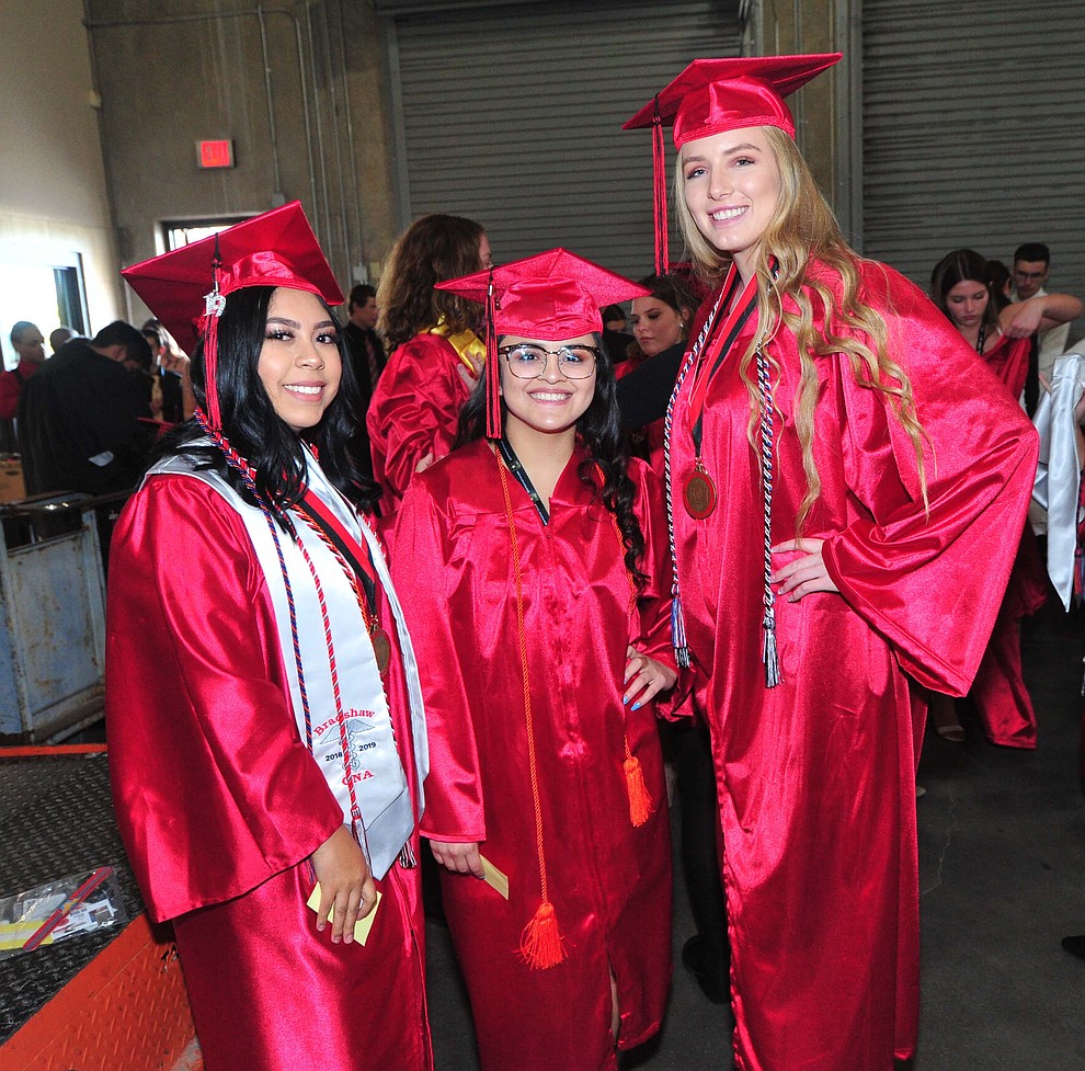 Diana Chaparro, Ashley Gonzalez and Riley Bundrick pose before Bradshaw Mountain High School graduated 334 students in a commencement ceremony Thursday, May 23 at the Findlay Toyota Center in Prescott Valley. (Les Stukenberg/Courier)