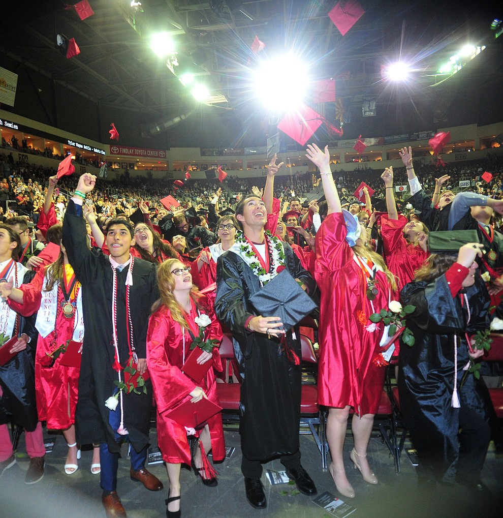 Graduates toss their mortar boards up as Bradshaw Mountain High School graduated 334 students in a commencement ceremony Thursday, May 23 at the Findlay Toyota Center in Prescott Valley. (Les Stukenberg/Courier)
