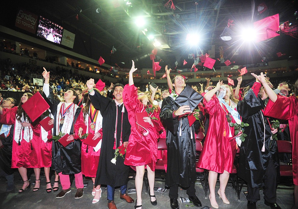 Graduates toss their mortar boards up as Bradshaw Mountain High School graduated 334 students in a commencement ceremony Thursday, May 23 at the Findlay Toyota Center in Prescott Valley. (Les Stukenberg/Courier)