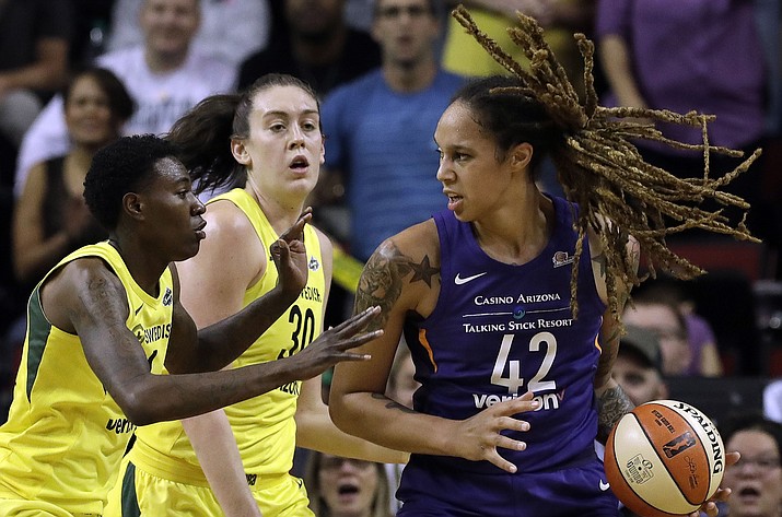 Phoenix Mercury’s Brittney Griner (42) is doubled-teamed by Seattle Storm’s Natasha Howard, left, and Breanna Stewart during the first half of Game 5 of a WNBA basketball playoffs semifinal, Tuesday, Sept. 4, 2018, in Seattle. (Elaine Thompson/AP, file)