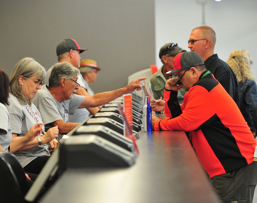 People get their bets in at opening day of Arizona Downs Friday, May 24 in Prescott Valley. The racetrack reopens under new ownership after being closed for 10 years. (Les Stukenberg/Courier)