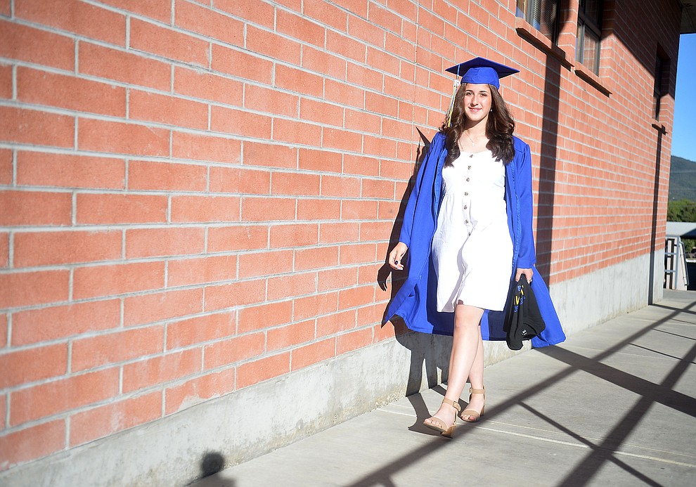Autumn Champlin walks along the breezeway for a last time before Prescott High School graduated 301 students in a commencement ceremony Friday, May 24 on Bill Shepard Field in Prescott. (Les Stukenberg/Courier)