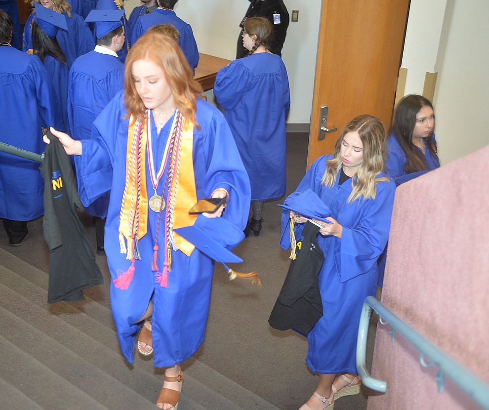 Erika Smith and Morgan Little before Prescott High School graduated 301 students in a commencement ceremony Friday, May 24 on Bill Shepard Field in Prescott. (Les Stukenberg/Courier)
