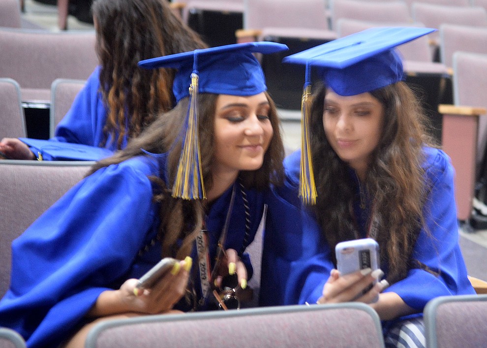 Cienna Madrigal and Tessa Eppele before Prescott High School graduated 301 students in a commencement ceremony Friday, May 24 on Bill Shepard Field in Prescott. (Les Stukenberg/Courier)