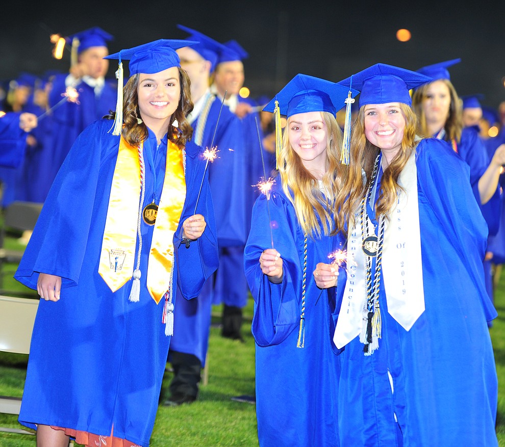 Students light sparklers as Prescott High School graduated 301 students in a commencement ceremony Friday, May 24 on Bill Shepard Field in Prescott. (Les Stukenberg/Courier)