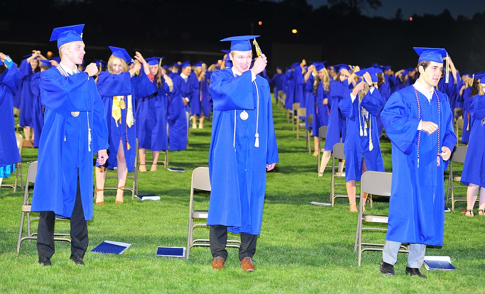 Students turn their tassles as Prescott High School graduated 301 students in a commencement ceremony Friday, May 24 on Bill Shepard Field in Prescott. (Les Stukenberg/Courier)