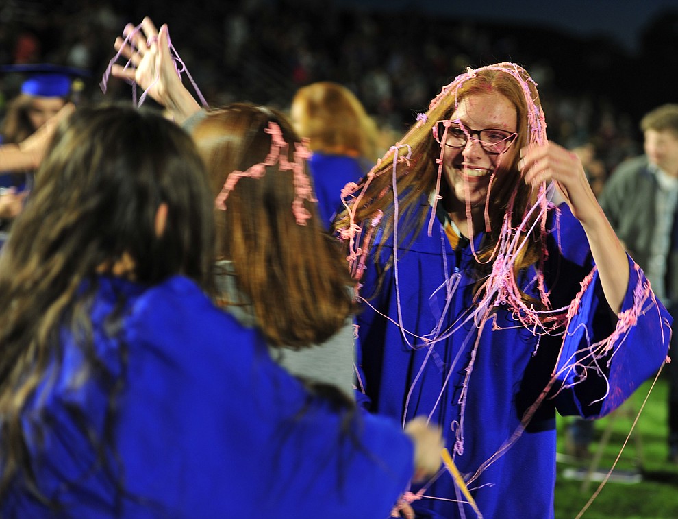 Katherine Seigler got silly stringed after Prescott High School graduated 301 students in a commencement ceremony Friday, May 24 on Bill Shepard Field in Prescott. (Les Stukenberg/Courier)