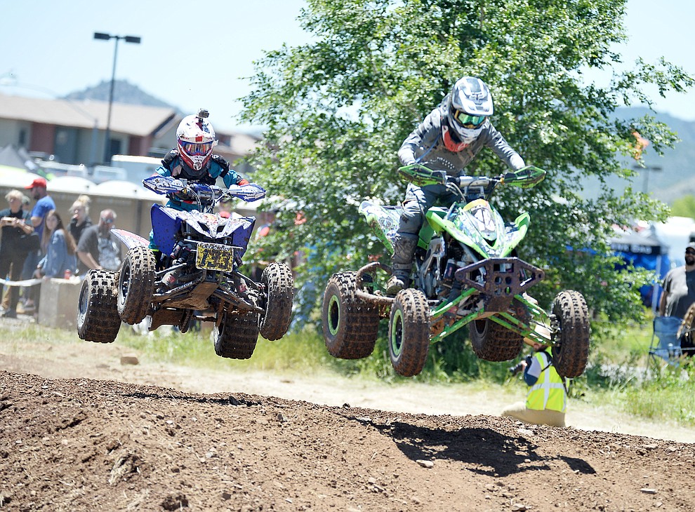 Quads fly through the air at the noon time hour during Arizona Off Road Promotion's Prescott Valley Grand Prix near the Findlay Toyota Center Saturday, May 25. in Prescott Valley. (Les Stukenberg/Courier)
