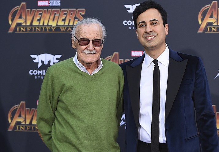 Stan Lee, left, and Keya Morgan arrive at the world premiere of "Avengers: Infinity War" April 23, 2018, in Los Angeles. Morgan, the former business manager of Lee has been arrested on elder abuse charges involving the late comic book icon. Los Angeles police say Morgan was taken into custody in Arizona early Saturday, May 25, 2019, on an outstanding arrest warrant. Morgan was charged earlier this month with felony allegations of theft, embezzlement, forgery or fraud against an elder adult, and false imprisonment of an elder adult. (Photo by Jordan Strauss/Invision/AP, File)