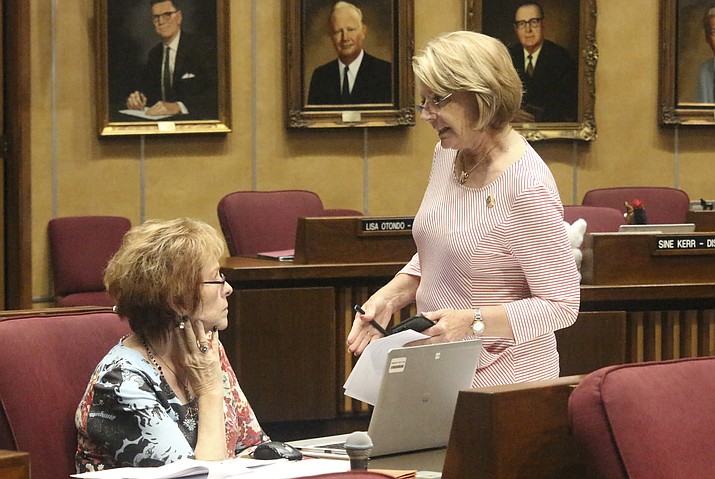 Arizona Senate President Karen Fann, right, confers with fellow Republican Sen. Sylvia Allen in the Senate building in Phoenix, Saturday, May 25, 2019. (Bob Christie/AP, file)