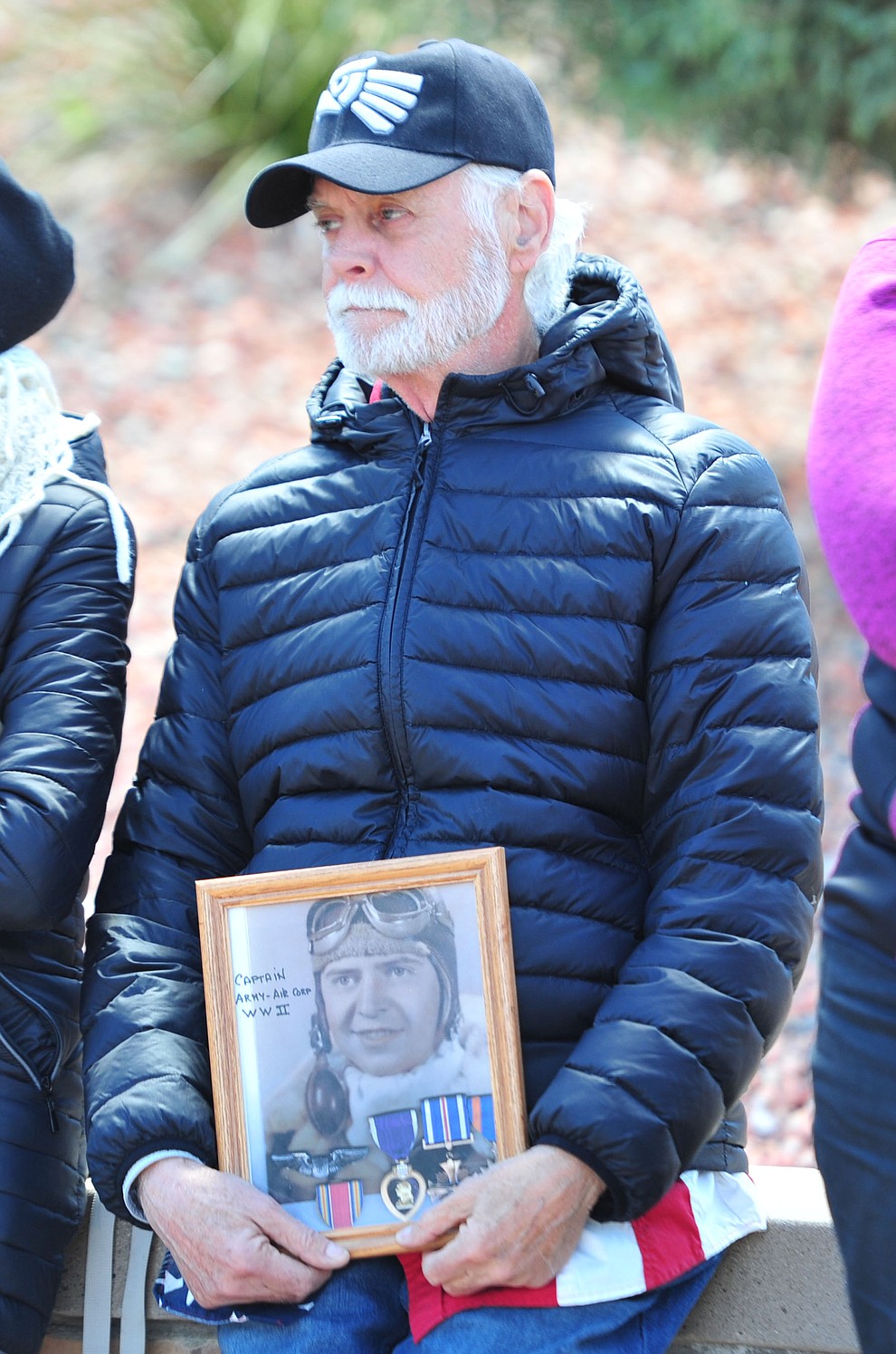 Tom Stachon holds a photo of his father Capt. Alex Stachon a World War II B-24 pilot during the Memorial Day Ceremony at the National Cemetery Monday, May 27 in Prescott. (Les Stukenberg/Courier)