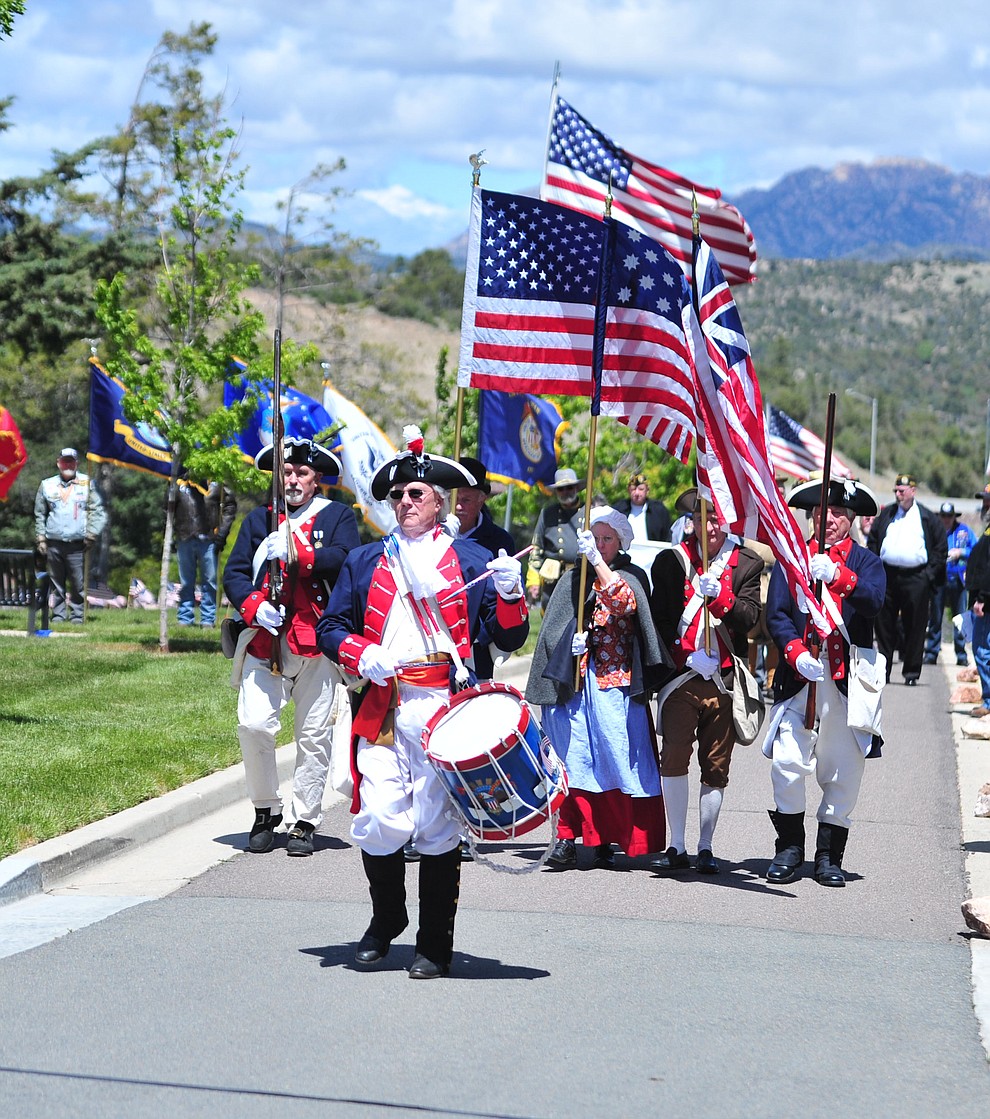 Members of the Sons of the American Revolution march in the processional during the Memorial Day Ceremony at the National Cemetery Monday, May 27 in Prescott. (Les Stukenberg/Courier)