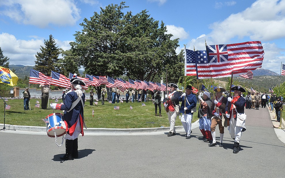 Members of the Sons of the American Revolution march in the processional during the Memorial Day Ceremony at the National Cemetery Monday, May 27 in Prescott. (Les Stukenberg/Courier)