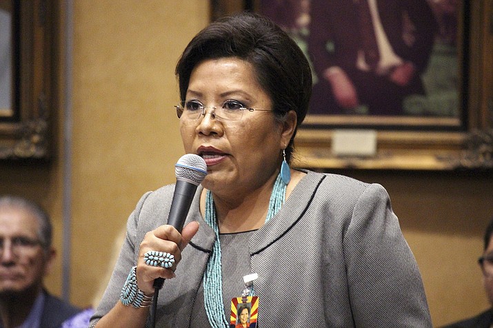 In this Jan. 11, 2017, file photo, Arizona Democratic Sen. Jamescita Peshlakai, a Democrat representing the Navajo Nation, addresses at a joint Senate and House session in Phoenix. Arizona lawmakers are moving to allow a handful of children from the Navajo Nation to continue using school vouchers at a Christian school in New Mexico. Emergency legislation approved in the House Friday, May 24, 2019, gives seven children another year to use their Empowerment Scholarship Account for private-school tuition in another state, though the law requires vouchers be used at Arizona schools. Peshlakai said Republicans support helping Native American children with private education but not with public education. (Bob Christie/AP, file)