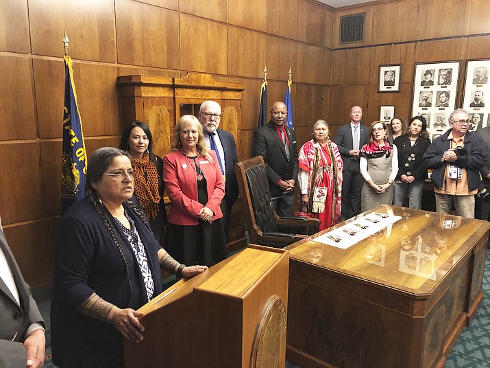 State Rep. Tawna Sanchez, a Portland Democrat and the only Native American in the Oregon Legislature, speaks in Salem, Oregon, after Gov. Kate Brown signed a bill directing the state police to study how to increase and improve criminal justice resources to solve cases of missing or murdered Native American women. (AP Photo/Andrew Selsky)