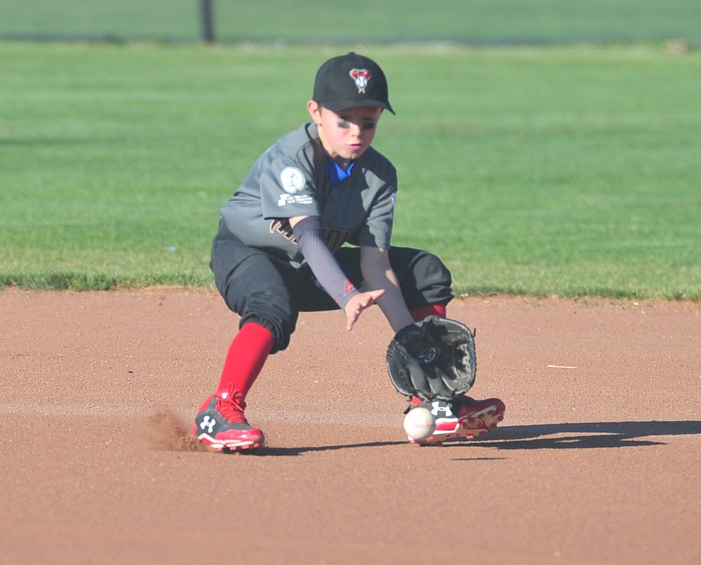 Prescott Valley's Trevor Field fields the ball at second base against Prescott at the Little League Tournament of Champions in Chino Valley Saturday May 31. (Les Stukenberg/Courier)
