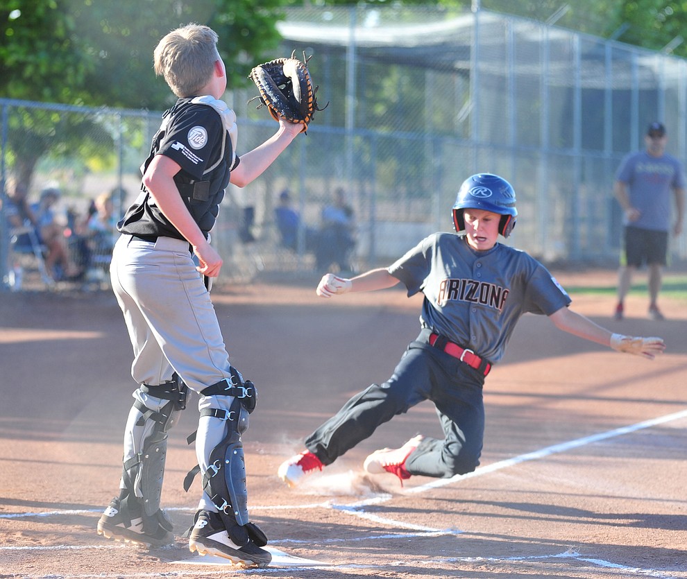 Prescott Valley's Connor Wallace scores against Prescott at the Little League Tournament of Champions in Chino Valley Saturday May 31. (Les Stukenberg/Courier)