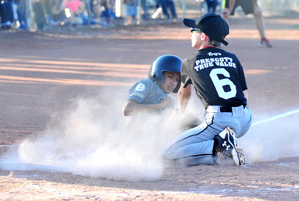 Prescott's Caden Bernier tags out Prescott Valley's Antonio Valenzuela at home at the Little League Tournament of Champions in Chino Valley Saturday May 31. (Les Stukenberg/Courier)