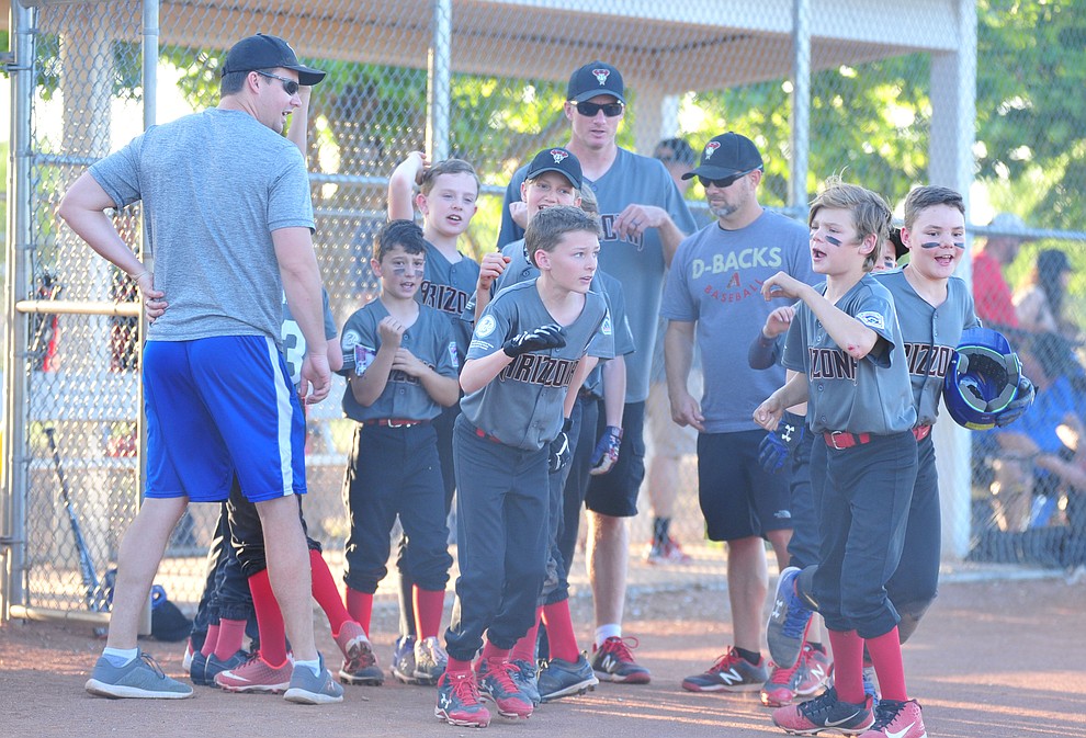 Prescott Valley players celebrate after defeating Prescott 14-4 at the Little League Tournament of Champions in Chino Valley Saturday May 31. (Les Stukenberg/Courier)