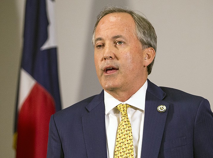 Texas Attorney General Ken Paxton speaks May 1, 2018, at a news conference in Austin, Texas. Computer files discovered in the home of Tom Hofeller , a Republican operative who died last year, contain a blueprint for how the GOP could extend its domination of legislatures in states where growing Latino populations favor Democrats and offer compelling context about a related case currently before the U.S. Supreme Court. Many of the state's top Republicans, including Paxton, have publicly expressed support for a citizenship question on the Census. (Nick Wagner/Austin American-Statesman via AP, File)