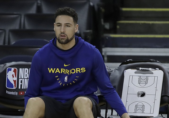 Golden State Warriors’ Klay Thompson sits on the bench during practice for the NBA Finals against the Toronto Raptors Tuesday, June 4, 2019, in Oakland. (Ben Margot/AP)