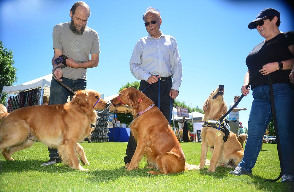 Ron Bistodeau with Frankie, Nitin Oatel with Sora and Debbie Lipely with Teddy Bear at Woofstock at the Civic Center in Prescott Valley Saturday, June 8, 2019. (Les Stukenberg/Courier)