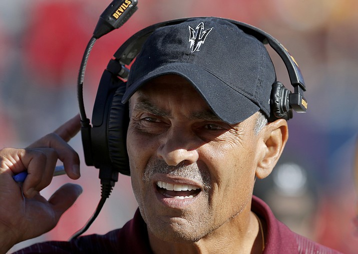 In this Nov. 24, 2018, photo, Arizona State head coach Herm Edwards watches during an NCAA college football game against Arizona in Tucson, Ariz. Edwards is adding a new title at Arizona State: Professor. The school announced Thursday, June 13, 2019, that the Arizona State head football coach will become a professor of practice at the Walter Cronkite School of Journalism and Mass Communication. (Rick Scuteri/AP, File)