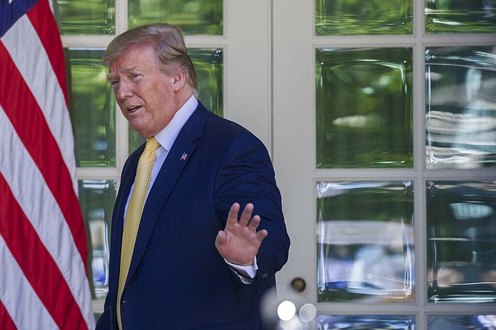 President Donald Trump waves as he departs after speaking in the Rose Garden of the White House, Friday, June 14, 2019, in Washington. (AP Photo/Alex Brandon)