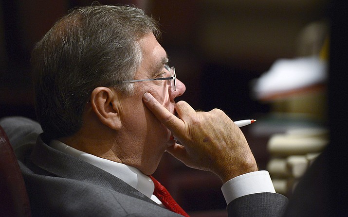 In a Feb. 12, 2014 file photo, Rep. Steve Hurst, R-Munford, watches discussion on the house floor in the Alabama Statehouse in Montgomery, Ala. Alabama lawmakers have approved legislation that would require certain sex offenders to be chemically castrated before being released on parole. The Alabama bill, sponsored by Republican Rep. Steve Hurst, would require sex offenders whose crimes involved children younger than 13 to receive the medication before being released from prison on parole. They would then be required to continue the medication until a judge decided they could stop. (Mickey Welsh/Montgomery Advertiser via AP)