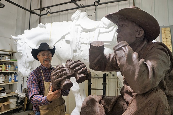 Prescott sculptor Bill Nebeker explains the process for construction of the larger-than-life bronze of “If Horses Could Talk” that is being created for the Deep Well Ranch roundabout on Highway 89. (Cindy Barks/Courier)
