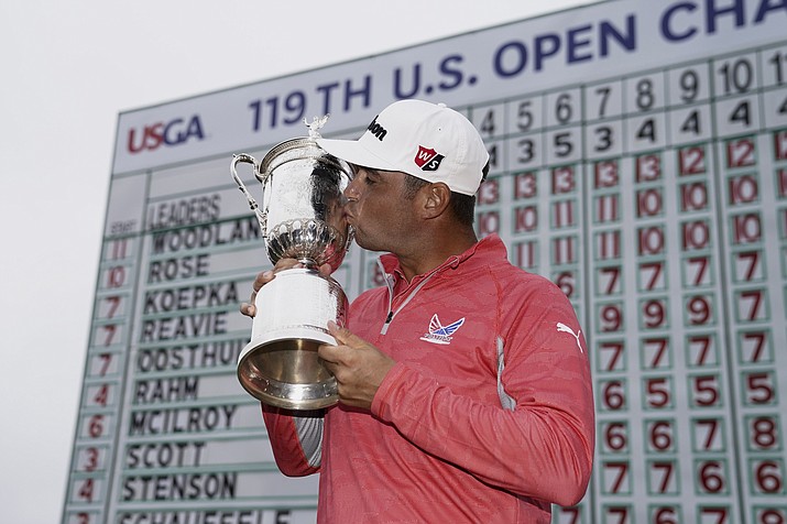 Gary Woodland posses with the trophy after winning the U.S. Open Championship Sunday, June 16, 2019, in Pebble Beach, Calif. (Carolyn Kaster/AP)