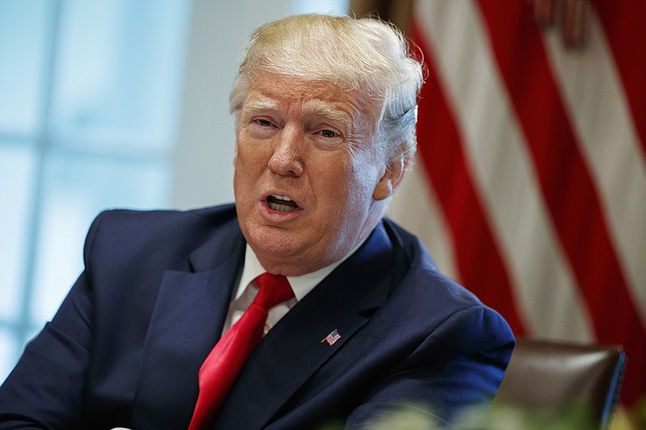 In this Thursday, June 13, 2019, file photo, President Donald Trump speaks during a meeting in the Cabinet Room of the White House, in Washington. In a tweet late Monday, June 17, 2019, Trump said that U.S. Immigration and Customs Enforcement will begin removing millions of people who are in the country illegally. (Evan Vucci/AP, File)