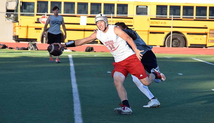 Mingus junior Drew Meyer reaches across the goal line to score a touchdown in a 7-on-7 game against Poston Butte on Thursday night at home.VVN/James Kelley