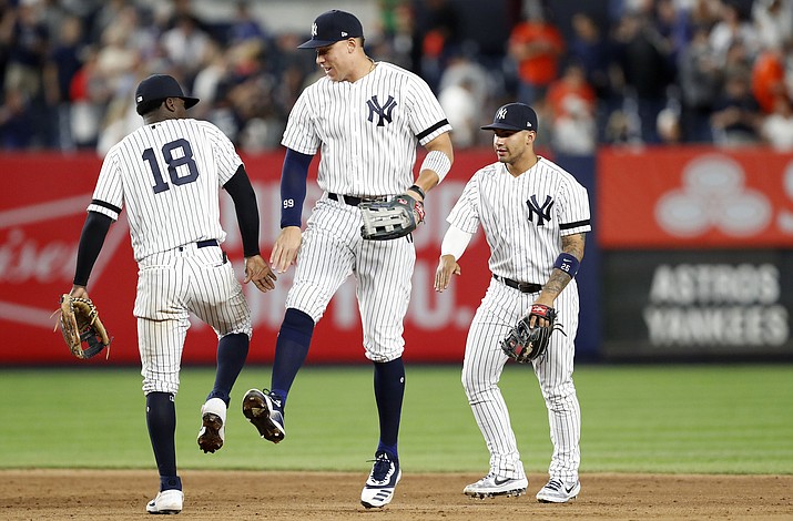 New York Yankees shortstop Didi Gregorius (18) celebrates with right fielder Aaron Judge, center, and second baseman Gleyber Torres after the Yankees defeated the Houston Astros 4-1 Friday, June 21, 2019, in New York. (Kathy Willens/AP)