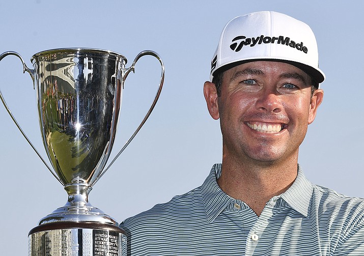 Chez Reavie, winner of the Travelers Championship golf tournament, poses with the trophy, Sunday, June 23, 2019, in Cromwell, Conn. (Jessica Hill/AP)