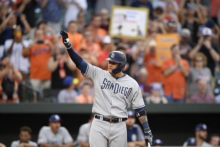 San Diego Padres' Manny Machado acknowledges the crowd during the first inning of a baseball game against his former team, the Baltimore Orioles, Tuesday, June 25, 2019, in Baltimore. (Nick Wass/AP)