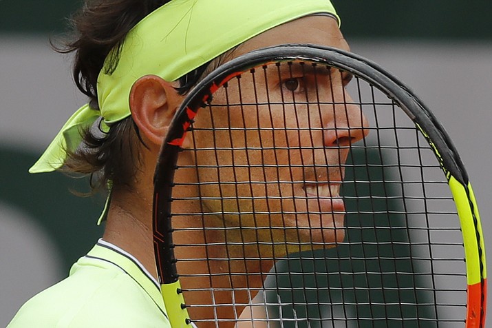 In this June 7, 2019, photo, Spain’s Rafael Nadal grimaces after scoring against Switzerland’s Roger Federer during their semifinal match of the French Open at the Roland Garros stadium in Paris. Eight-time champion Roger Federer was seeded No. 2 for Wimbledon, one spot ahead of Rafael Nadal, reversing their positions in the ATP rankings and creating a debate about whether the All England Club’s seeding system should be changed. (Michel Euler/AP, file)
