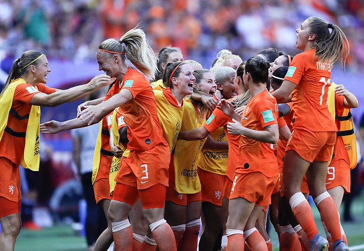Netherlands' players celebrate their victory after the Women's World Cup quarterfinal between Italy and the Netherlands, at the Stade du Hainaut stadium in Valenciennes, France, Saturday, June 29, 2019. (Michel Spingler/AP)