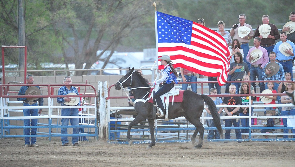 Presenting the American flag during the first performance of the Prescott Frontier Days Rodeo Monday July 1, 2019. (Les Stukenberg/Courier)
